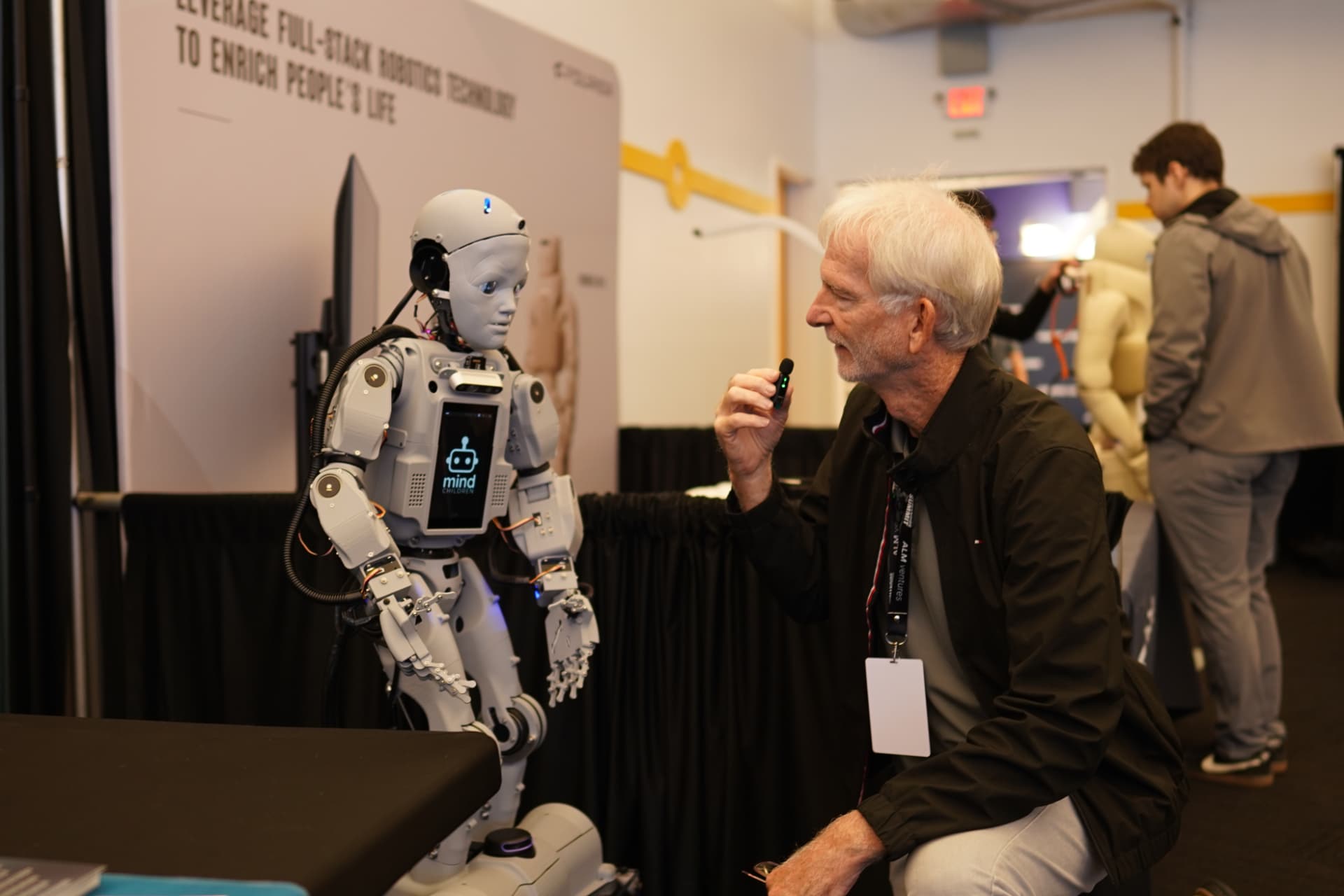 Codey the robot connecting with a person at an event