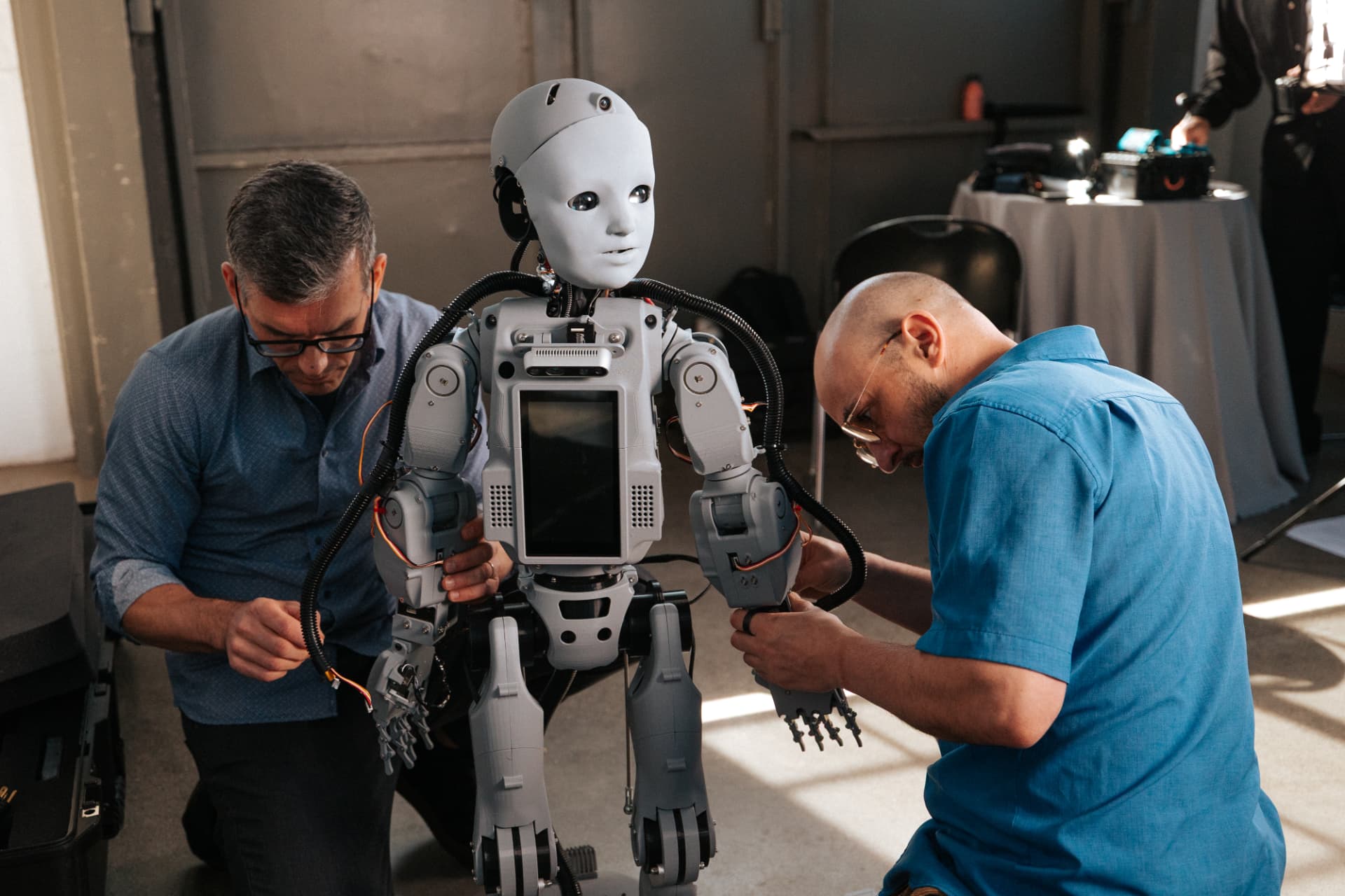 Engineers assembling Codey the robot